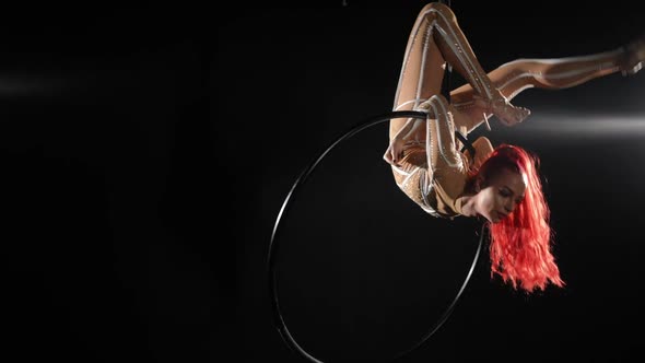 Wide Shot Flexible Slim Woman Hanging on Air Hoop Doing Tricks As Partner Entering Helping