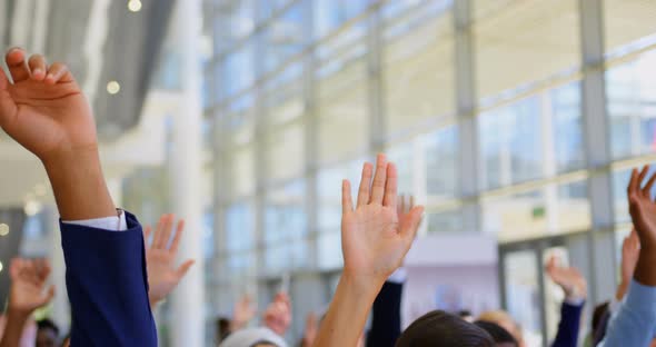 Multi ethnic business people raising hands in the business seminar 4k