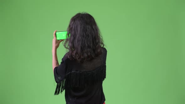 Young Beautiful Woman Taking Picture with Phone