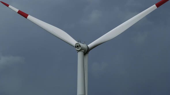 Windmill or Wind Turbine on Wind Farm in Rotation