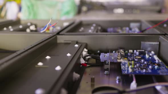 Slider Shot of a Metal Components and Microcircuits in Workshop Laboratory