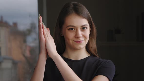 Portrait of Grateful Woman Millennial Caucasian Girl Looking at Camera Applauding Hands Claping
