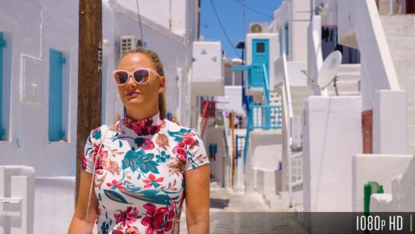 Young Woman in Dress Walking the Streets of Mykonos Town in Slow Motion, Greece