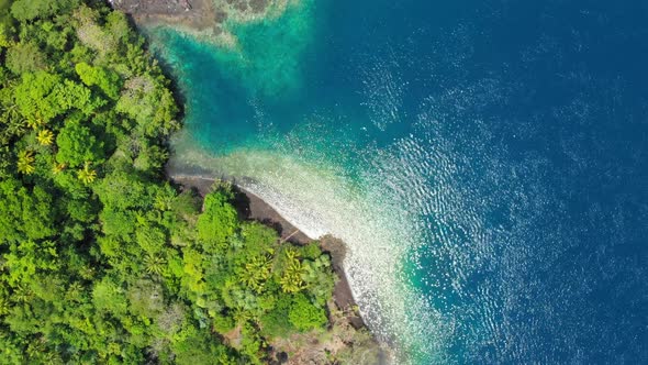 Aerial: flying over Banda Islands active volcano Gunung Api lava flows Maluku In