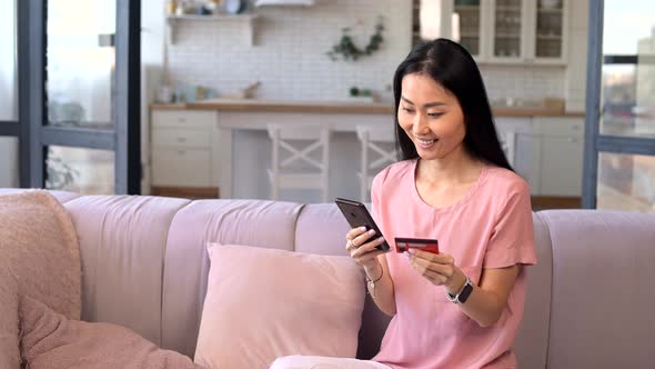 Online Shopping Success Concept Portrait of Happy Woman with Phone and Credit Card Buying Online