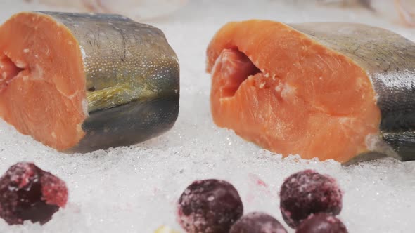 Closeup Dolly Shot DOF Fresh Salmon Pieces on the Snow Lie in a Market Window