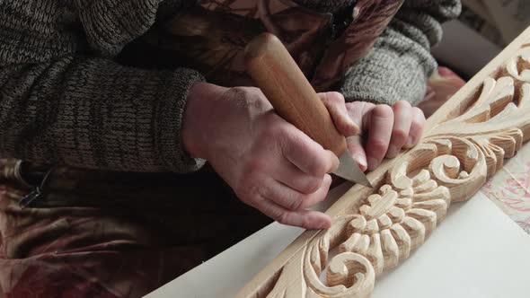 Closeup shoot of a woodcarver at work