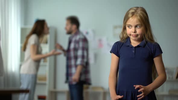 Divorce and Children, Unhappy Little Girl Suffering Quarrels Between Parents