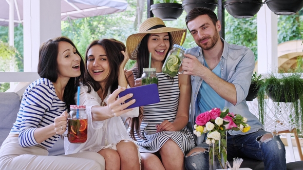 Group of Friends Makes Selfie in at Cafe