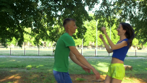 Joyful Sporty Couple Meeting During Outdoors Workout