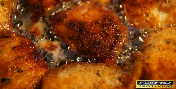 Fried Meat In Oil Close Up