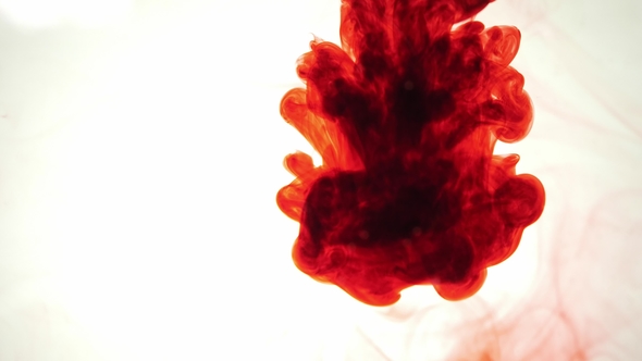 Colorful Rainbow Paint Drops From the Bottom Mixing in Water alt