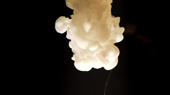 Colorful Rainbow Paint Drops From the Bottom Mixing in Water. . alt