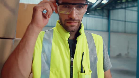 Professional Industry Worker Close Up Portrait in the Factory or Warehouse