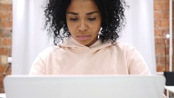 Portrait of Smiling Positive African Woman Working on Laptop