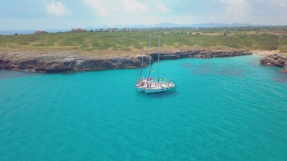 Top View of the Sailing Boats in Blue Lagoon. Swimmers Enjoying in Clear Blue Sea