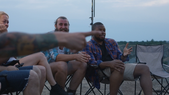 Laughing Diverse Friends Playing Charades in Camp