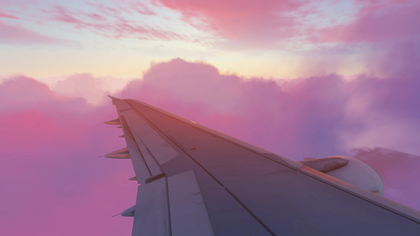 Jet Flying Over Cloudscape At Sunrise alt