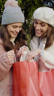 Close up video of women boasting about already made shopping. Shot with RED helium camera in 8K.  