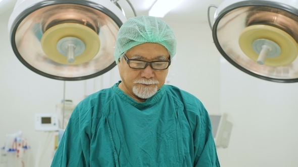 Portrait of Senior Male Surgeon in Operating Theater.