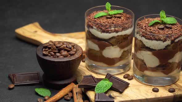 Classic Tiramisu Dessert in a Glass on Dark Concrete Background