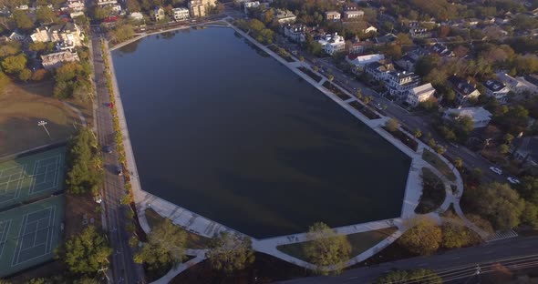 Aerial Flyover of Downtown Charleston SC and Colonial Lake in Early Morning