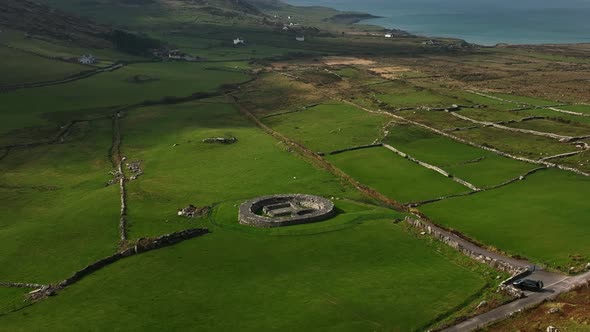 Loher Ringfort, Kerry, Ireland, March 2022. Drone orbits the ancient monument from the northeast asc