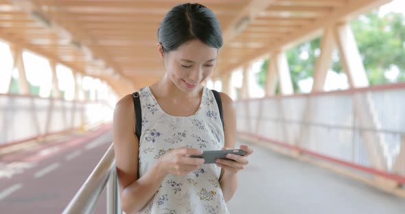 Woman using cellphone at outdoor