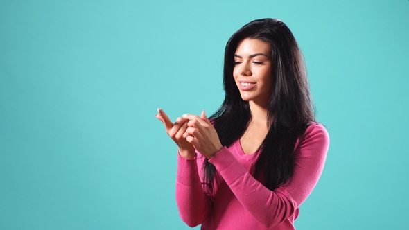 Young Girl Bends Her Fingers on Her Hand. The Girl Makes a Wish