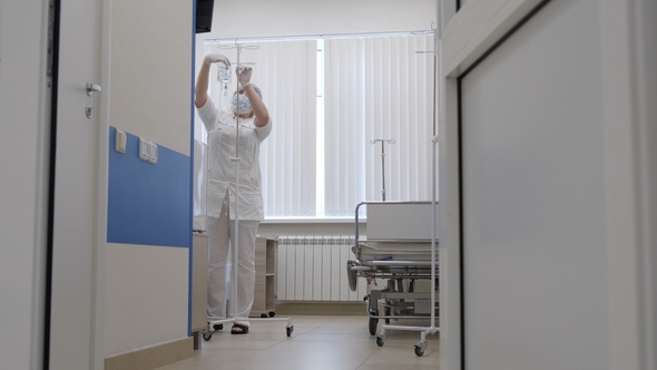 A Nurse in the Patient's Ward Prepares To Make a Drip