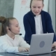 Pretty Two Little Girl in Headset Using Laptop and Flipchart in Office - VideoHive Item for Sale
