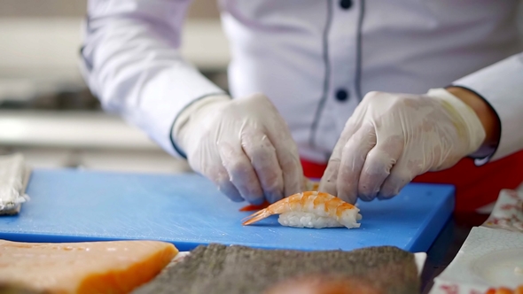 Hands Cook Rice Complement the Meat of the Shrimp Tail for Making Delicious Sushi