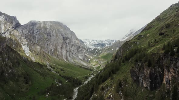 Panoramic View of a Picturesque Mountain Valley with a Village in a Lowland