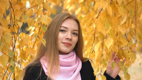 Portrait of Girl in Autumn Park