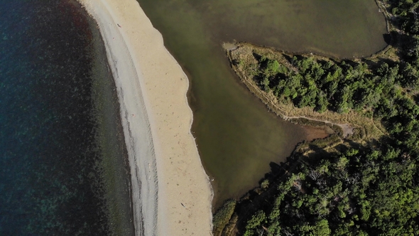 Aerial Flight with Drone DJI Over Green Mountains and White Sandy Beach