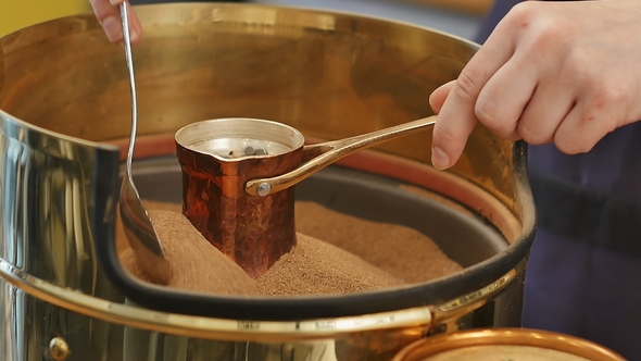 Preparation of Turkish Coffee in Copper Cezve on the Hot Sand