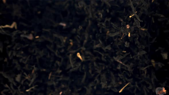 Super Slow Motion Dry Tea Soars Up and Falls Down