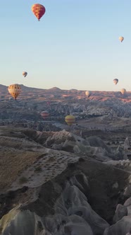 Vertical Video of Hot Air Balloons Flying in the Sky Over Cappadocia Turkey