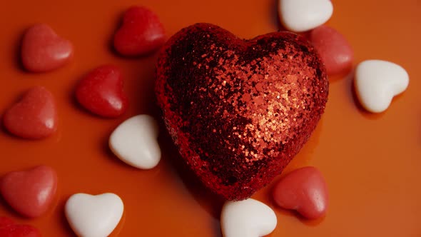 Rotating stock footage shot of Valentines decorations and candies - VALENTINES 0046