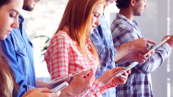 Business colleagues using electronic devices