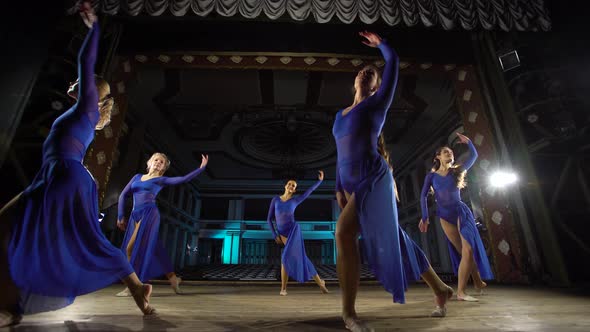 Group Young Skillful Ballerinas Dancing Modern Ballet on the Stage of Large Hall