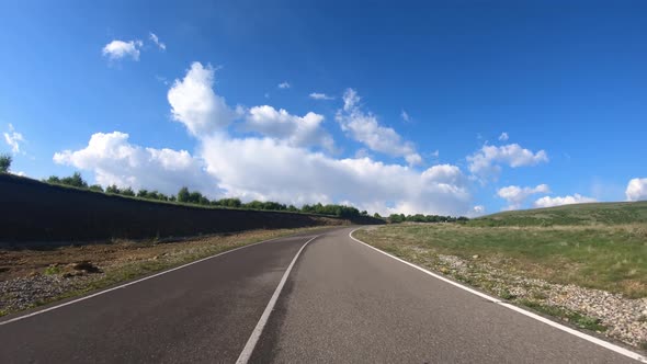 Point of View Driving a Car on a Road