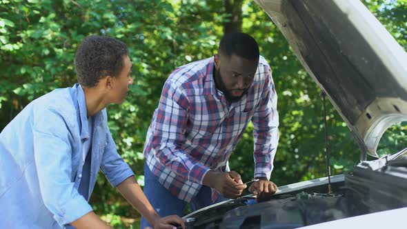 American Father Explaining Car Structure to Son Showing Auto Parts, Togetherness