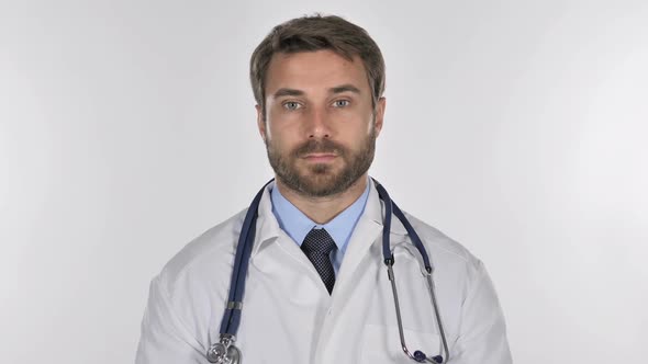 Doctor Looking at Camera in Studio on White Background