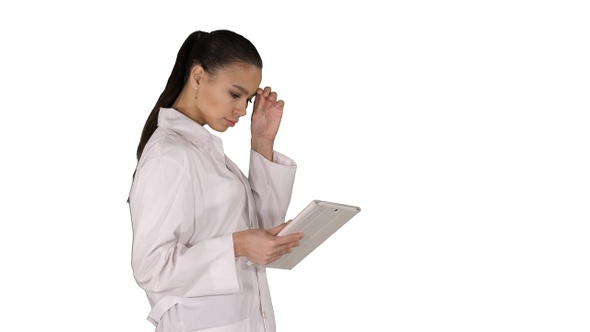 Woman Doctor Using Tablet Pc and Walking on White Background