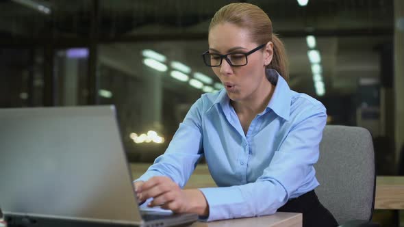 Extremely Happy Businesswoman Dancing in Workplace, Celebrating Successful News