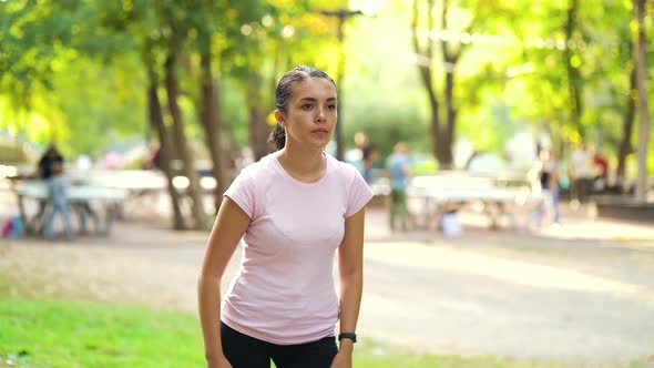 Woman getting ready for jogging in park