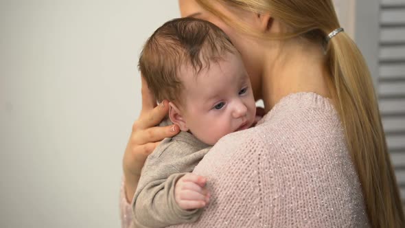 Young Mom Holding Cute Baby Boy in Arms, Vaginal Birth and Natural Motherhood