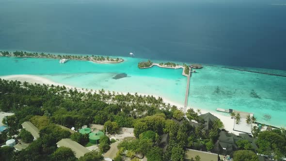 Aerial Drone View of a Beautiful Atoll or Island with a Resort in the Maldives