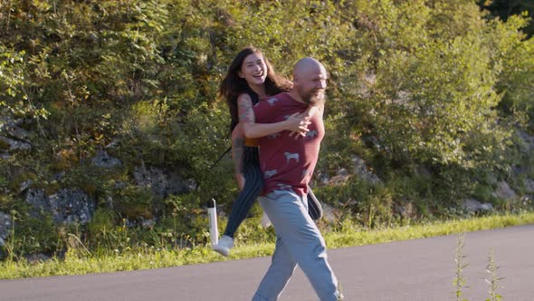 a Couple of Hipster Lovers Have Fun While Walking